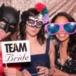 bridesmaids making faces and having fun photo booth
