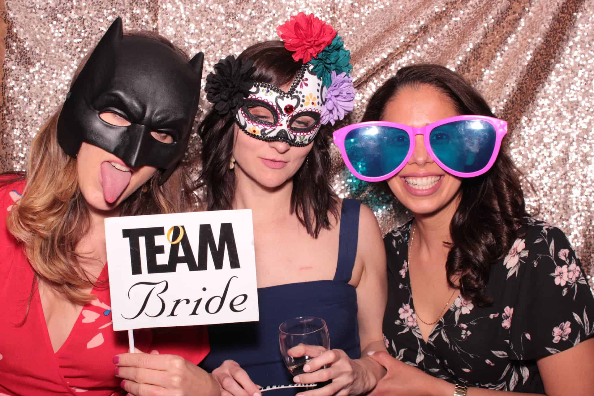 bridesmaids making faces and having fun photo booth