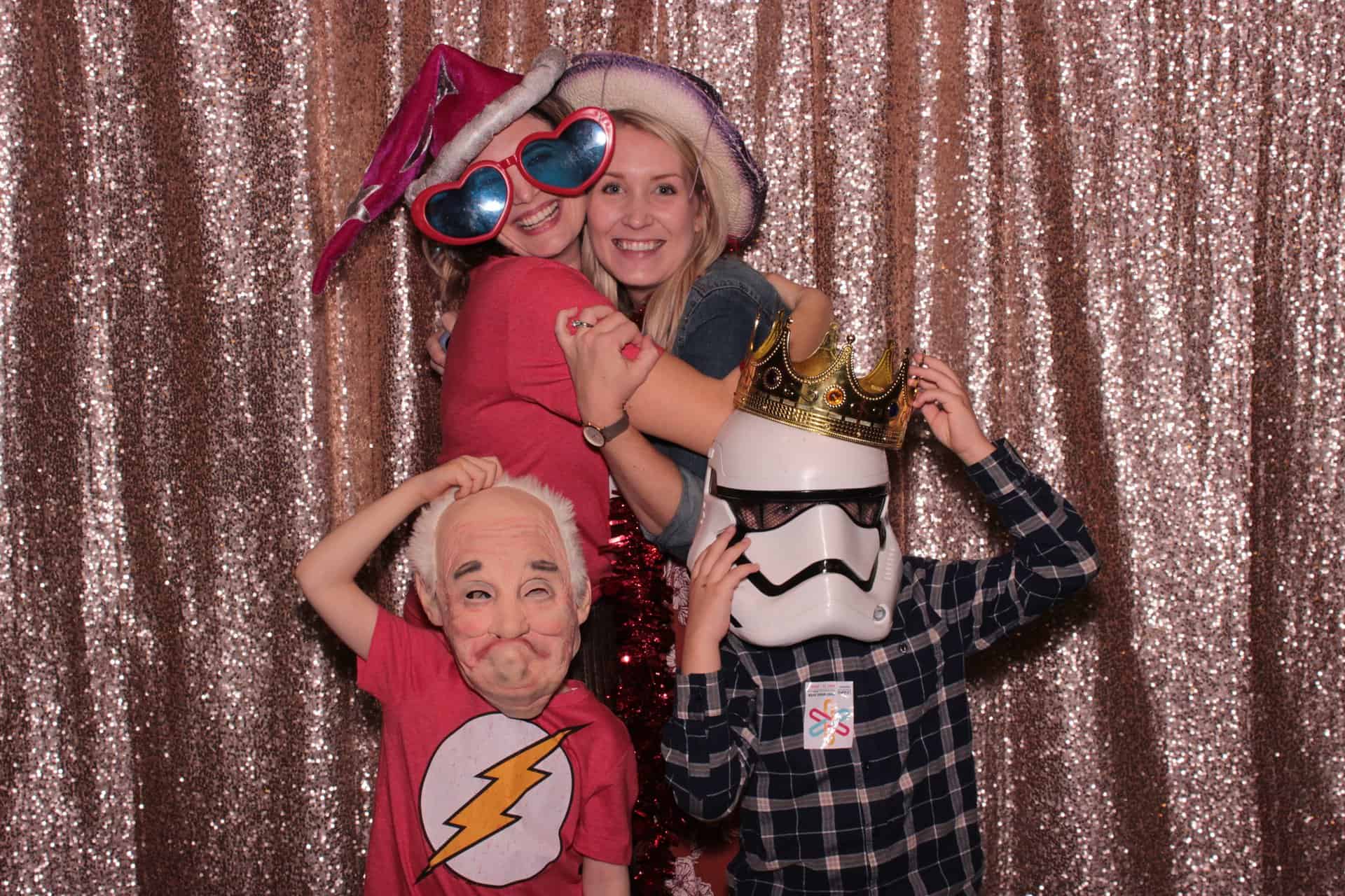 Family taking photos inside a photo booth